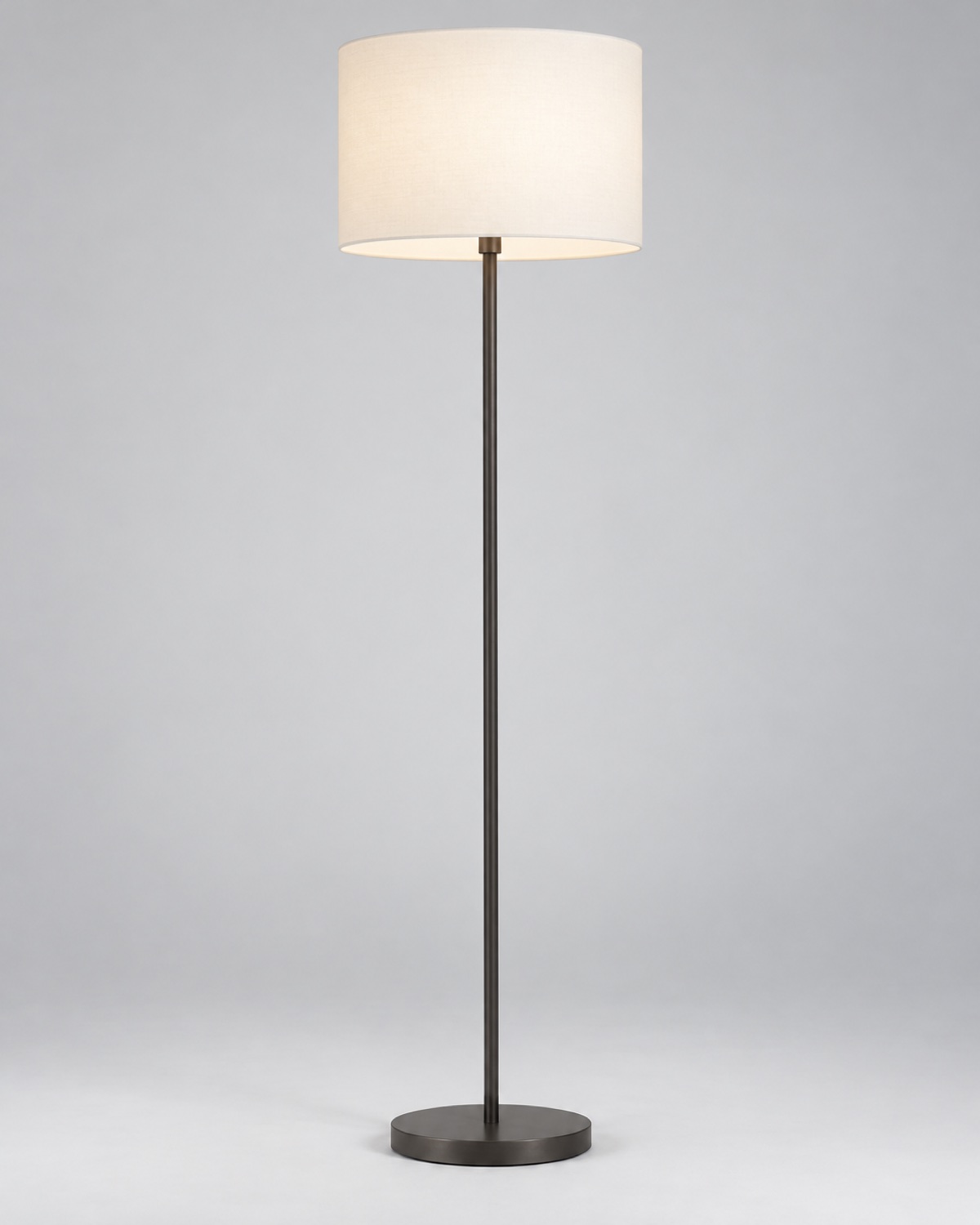 Tall graphite floor lamp with a white cylindrical shade