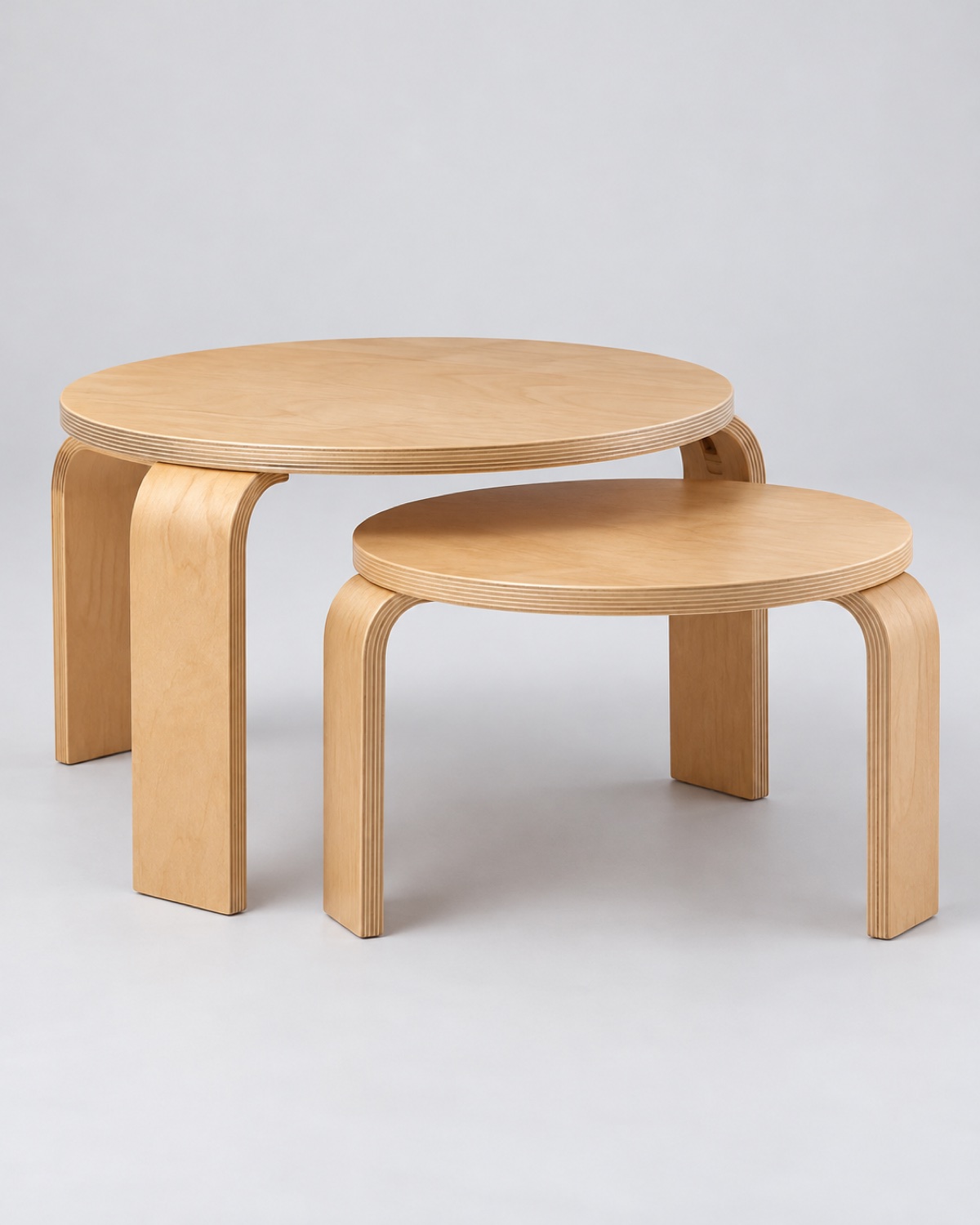 Pair of curved birch plywood nesting tables